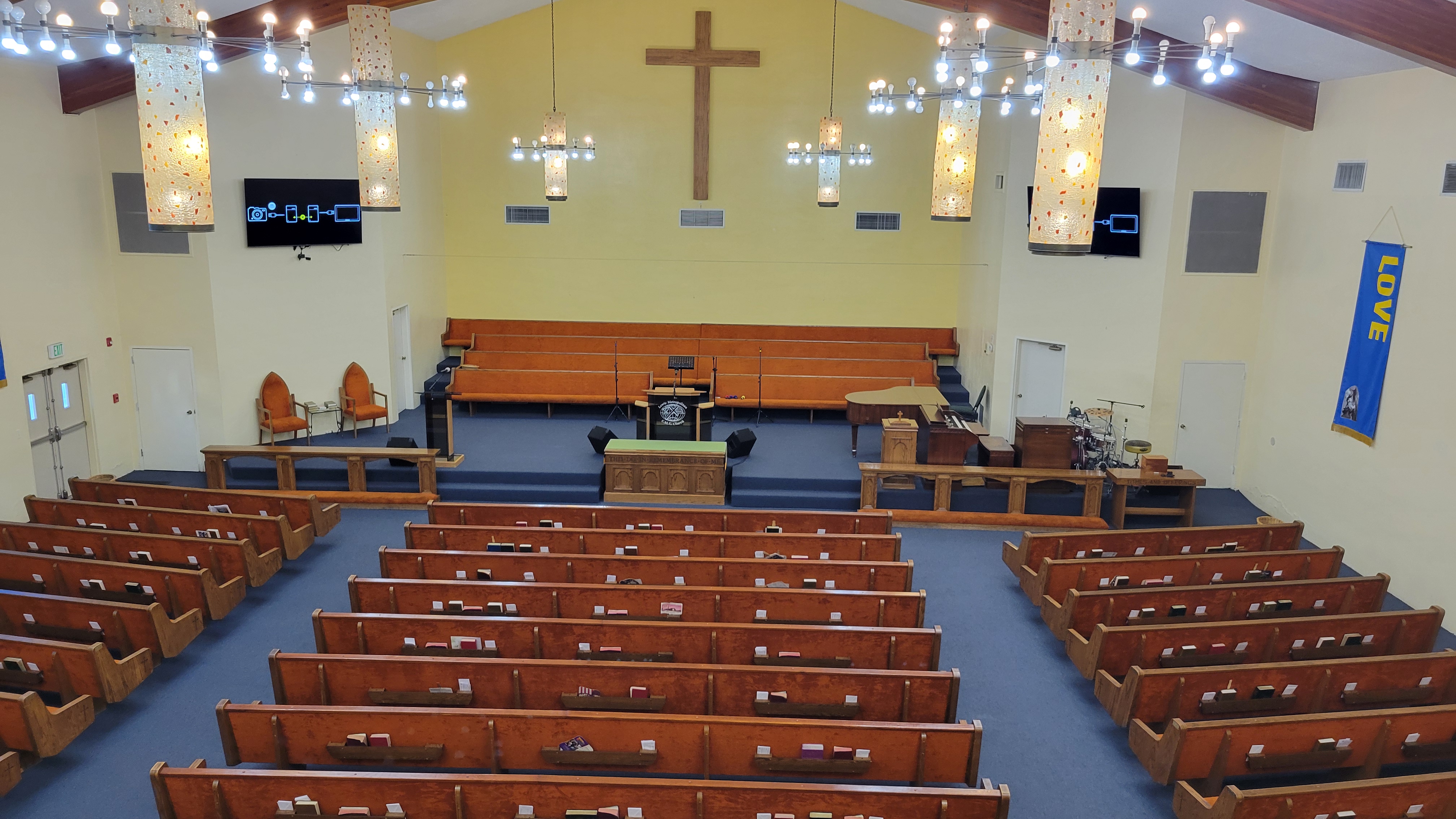 Friendly church members greeting each other, creating a warm and welcoming atmosphere.