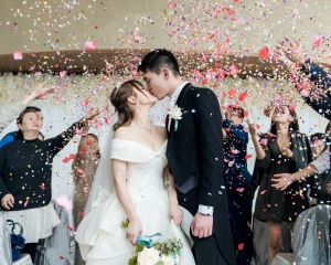 Couple Kissing on wedding day