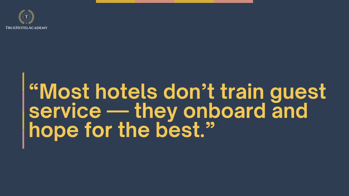A dark blue background with a quote in large yellow text that reads, 'Most hotels don't train guest service — they onboard and hope for the best.' In the top left corner, there is a logo for TRUE HOTEL ACADEMY, featuring a golden 'T' within a laurel wreath.