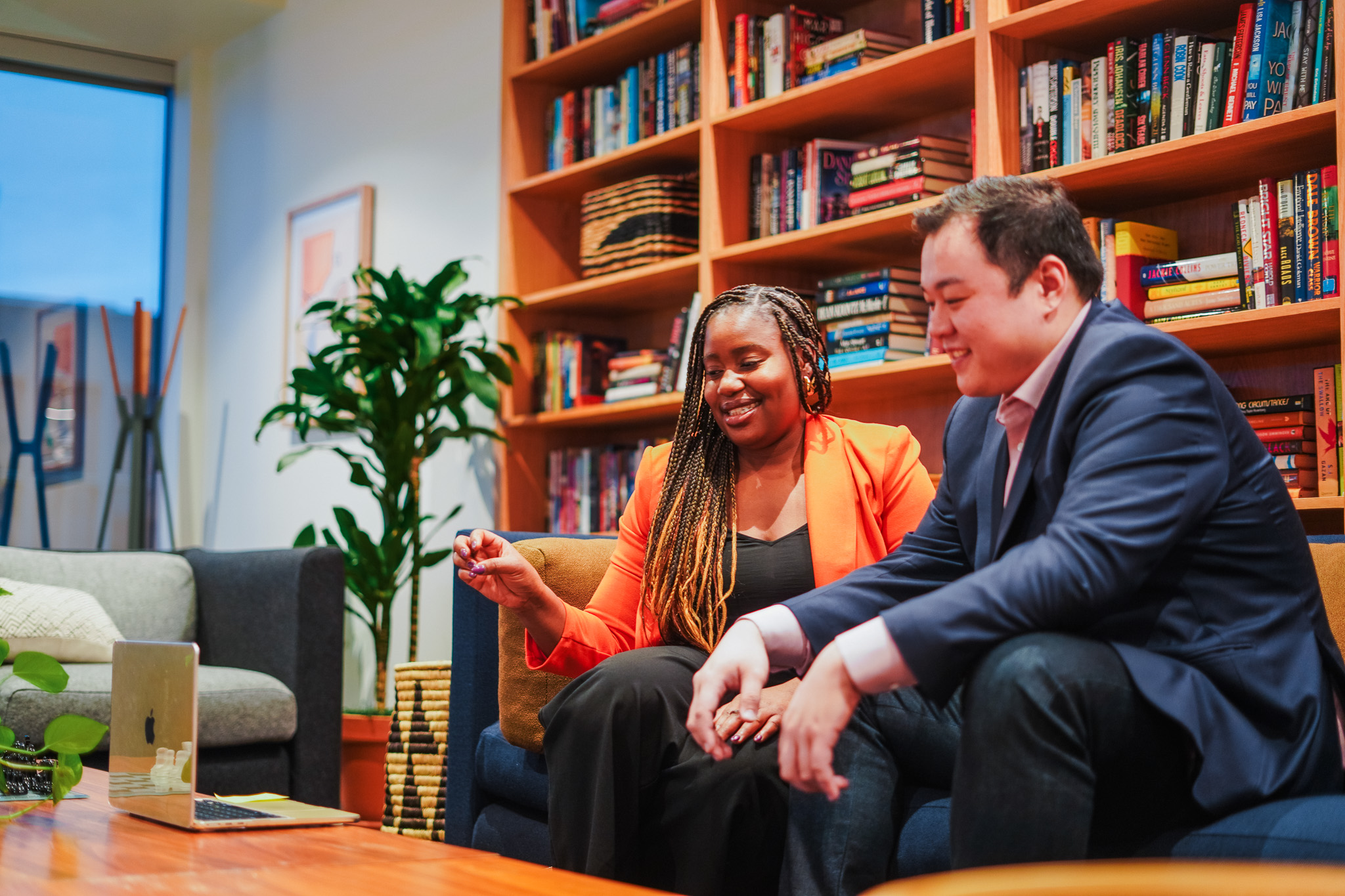 Two women smiling at a cafe table