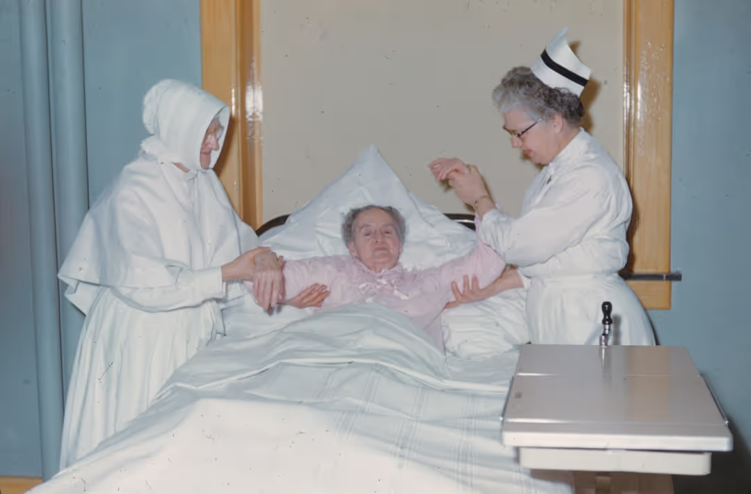 A nurse gently comforting a patient, showing a warm and supportive interaction.