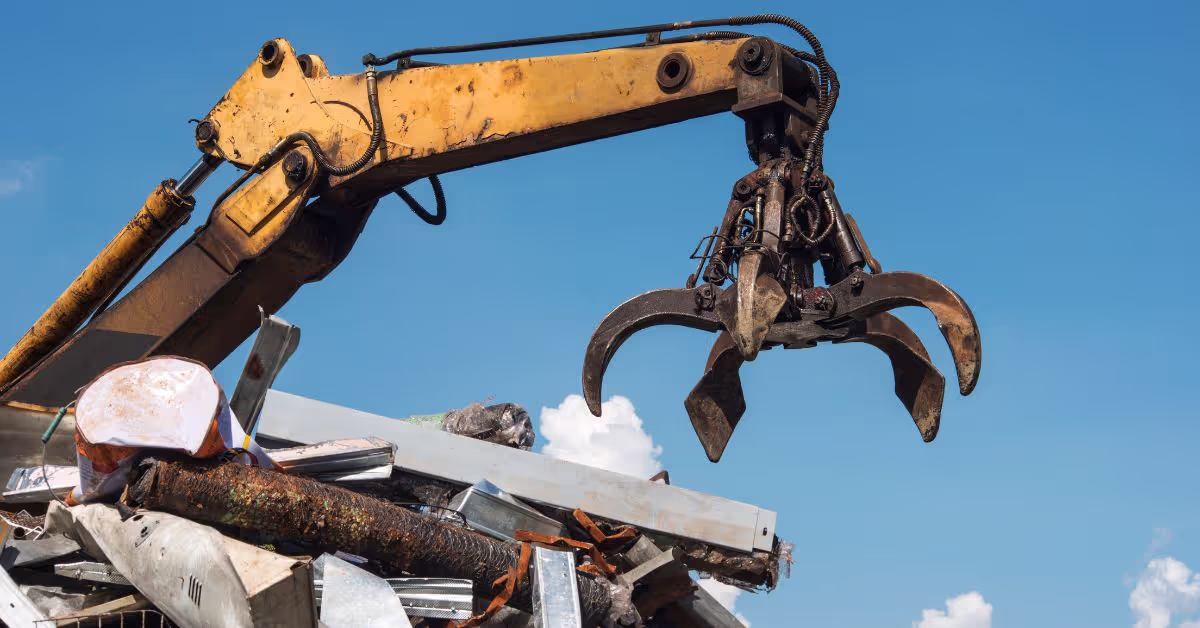 Why Businesses Choose Commercial Scrap Metal Pickup in Sacramento | On-Site Recycling Solutions Large truck performing commercial scrap metal pickup Sacramento, loading copper and steel materials from a construction site during on-site recycling service.