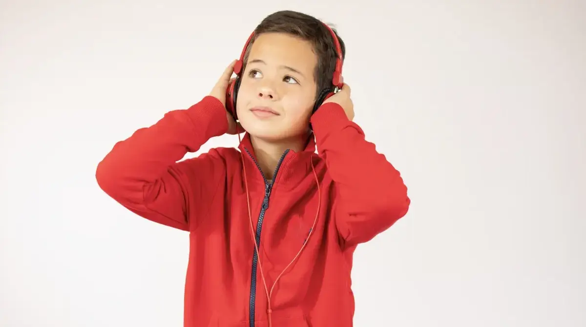 Boy wearing ear muffs