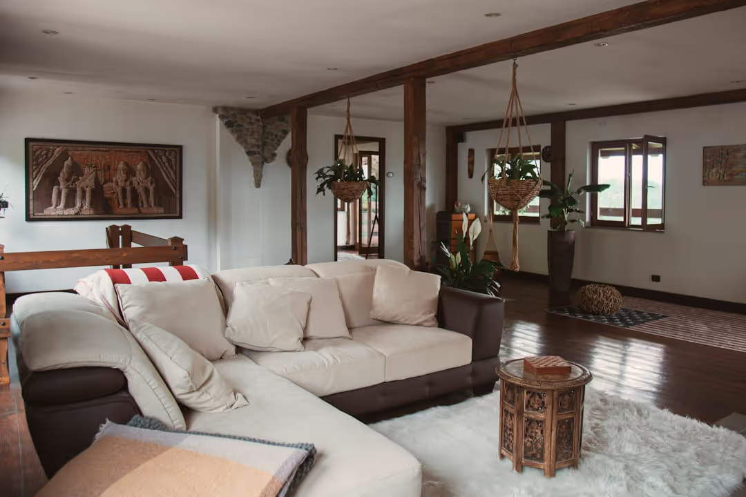 The cozy and inviting living room of Doon Niwas, featuring traditional Indian decor and comfortable seating.