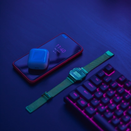Cell phone, Earphone, Watch and Keyboard on desk