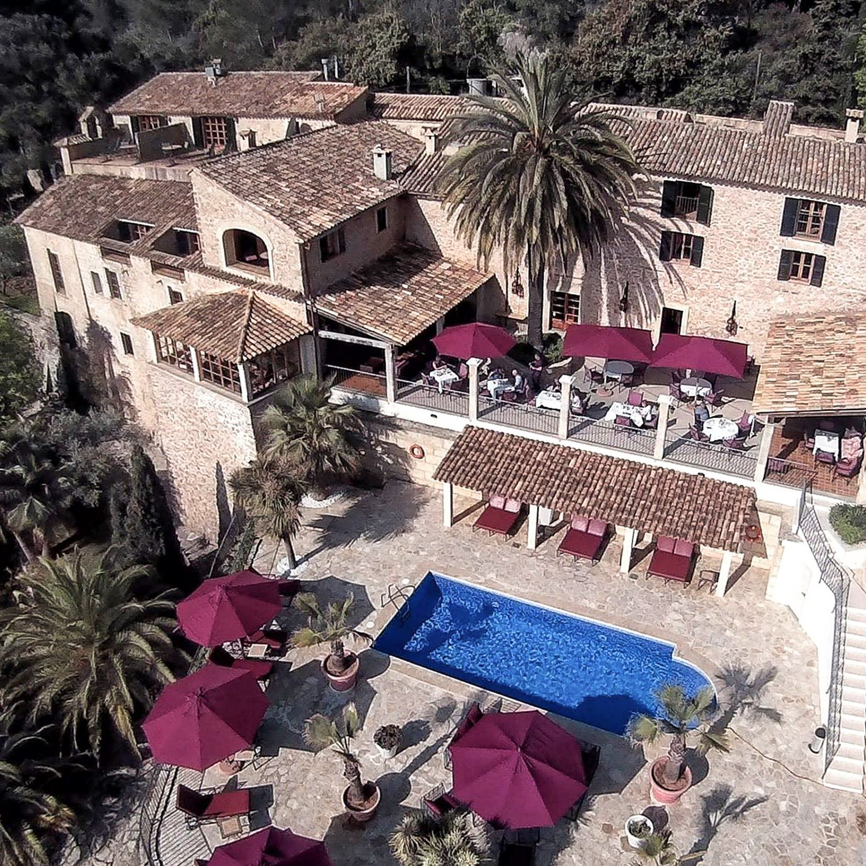 A photograph showing the beautifully restored facade of Posada del Marqués during a key renovation period, blending old and new.