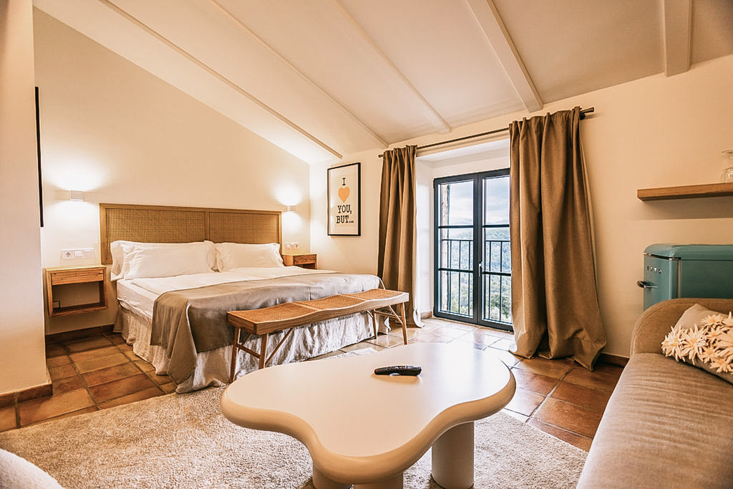 Luxurious king-size bed with pristine white linens and decorative pillows