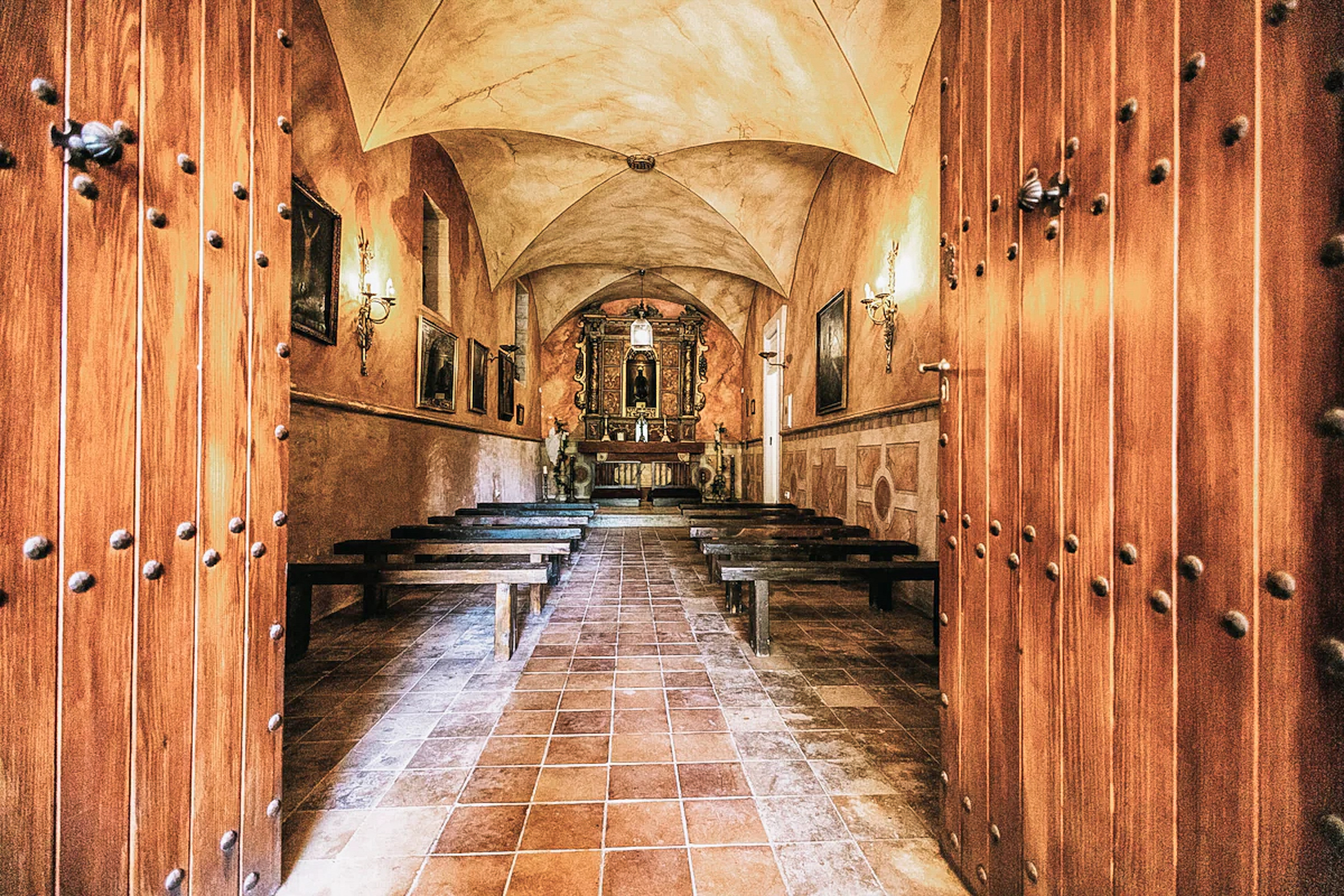 Historic Mallorcan finca architecture with ancient stone walls and olive trees.
