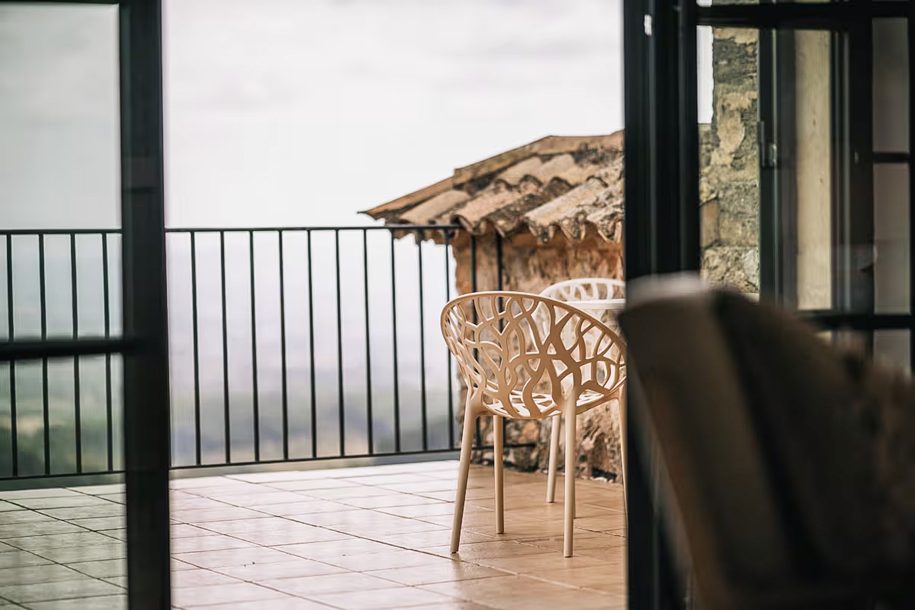 A cozy sitting area within the Junior Suite, featuring comfortable armchairs and a small table.