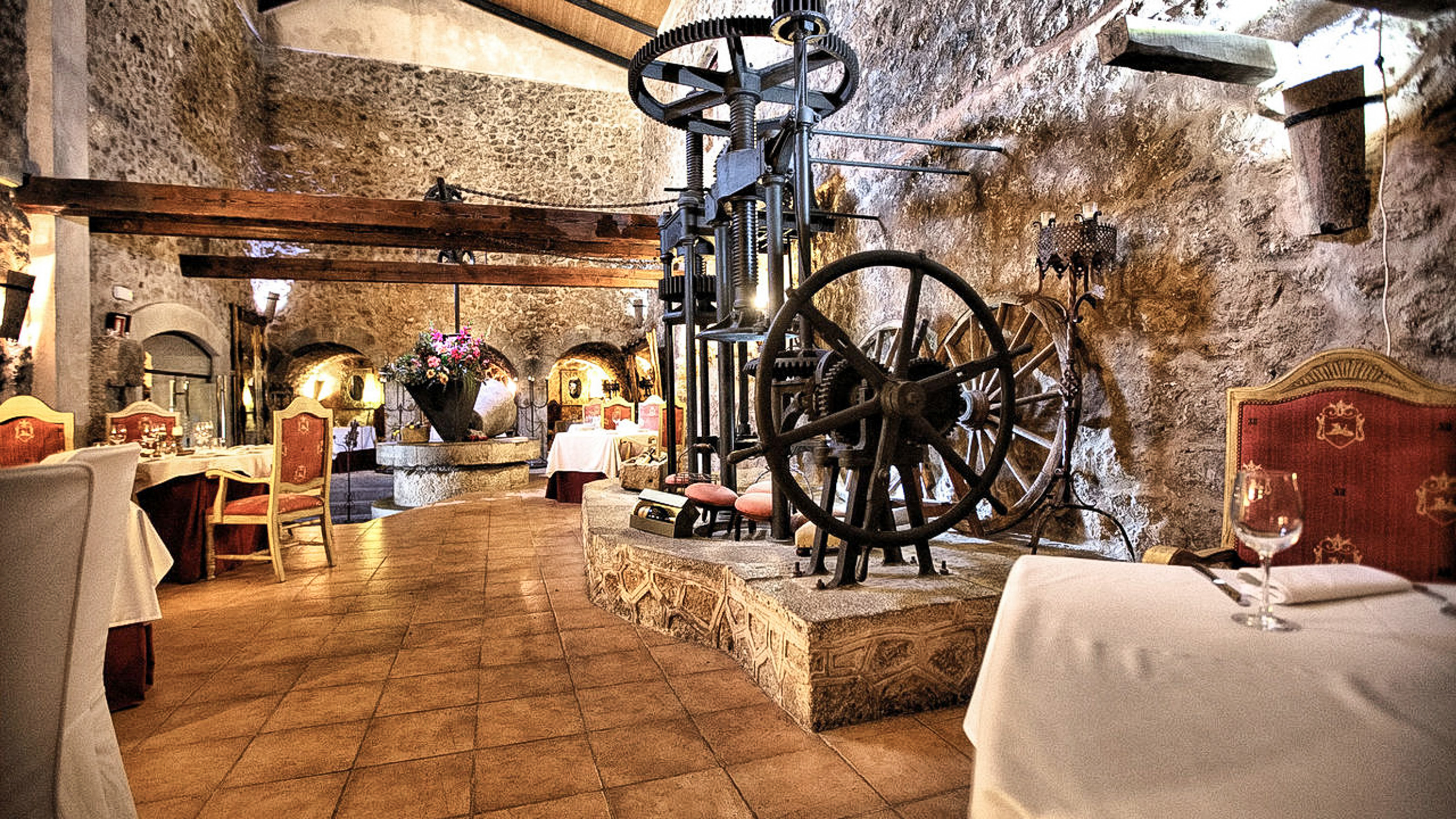 Interior of a 400-year-old olive oil mill (Tafona) with historic machinery