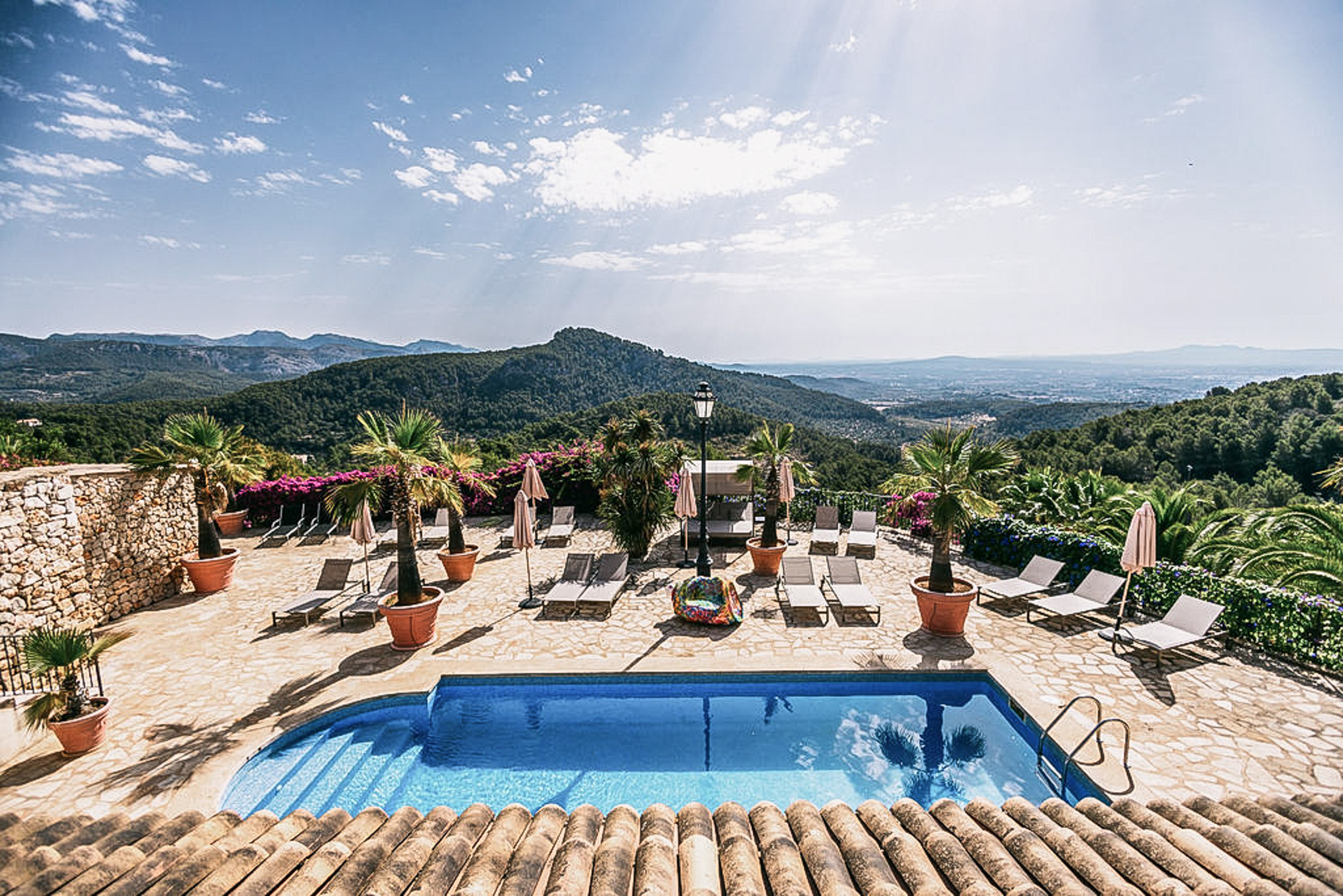 A guest relaxing in a tranquil garden, embodying slow design