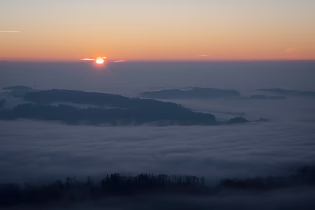 Sun rising over mountains