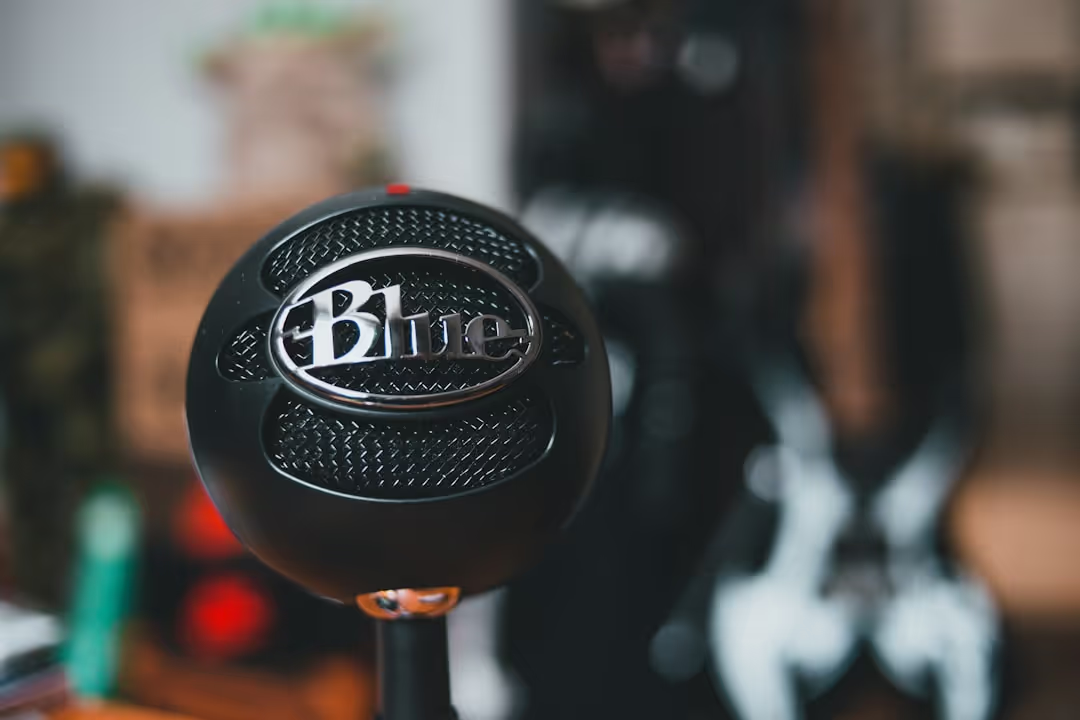 Podcast thumbnail showing a microphone and headphones